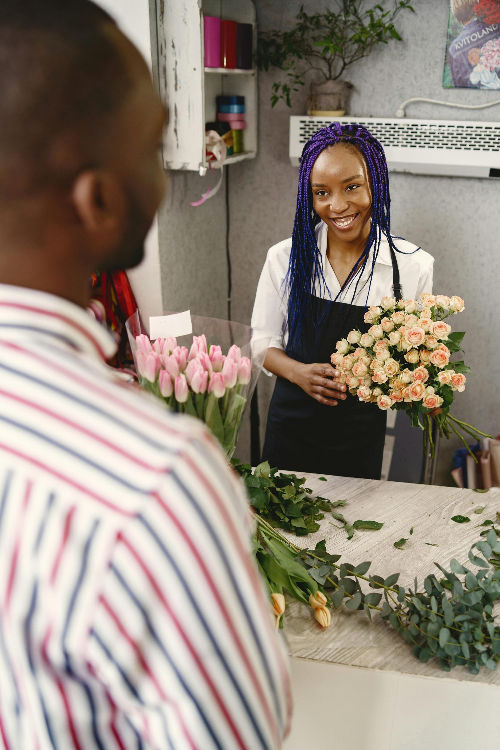 A woman holding a bouquet of flowers. 
How Does Fractional HR Reduce Founder Dependency?
